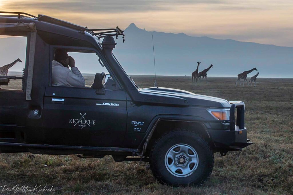 Kicheche Laikipia Active guide with giraffe